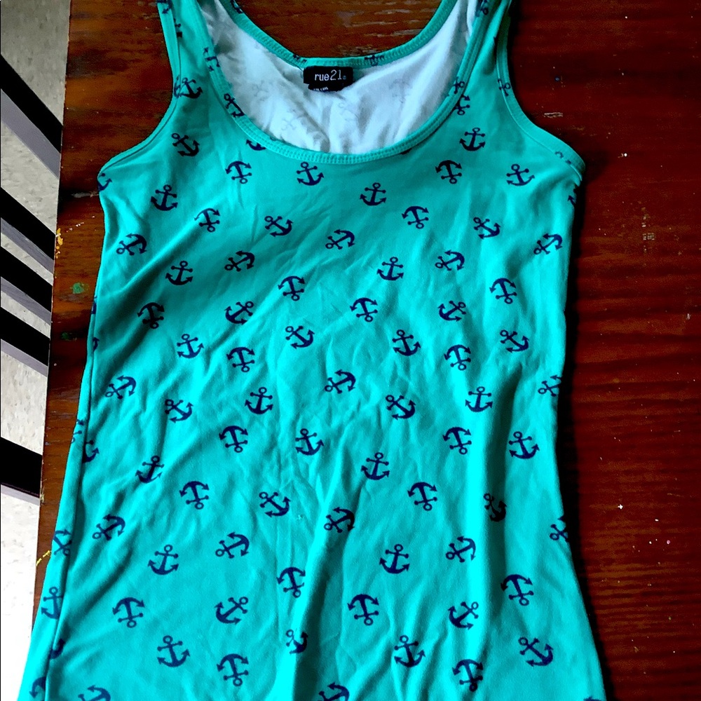 This photo has a cute blue tank top with black anchors. It’s great for summer!